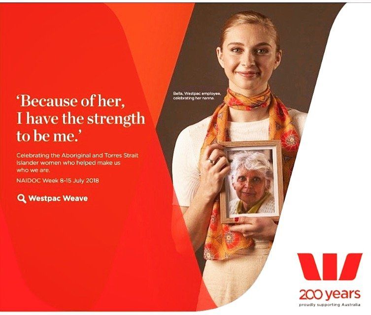 A woman is holding a picture of an older woman and says 
