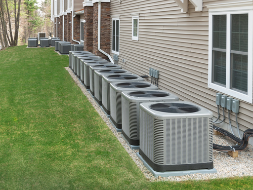 Heat — Air Compressors Outside The Industry Building in Shoals, AL