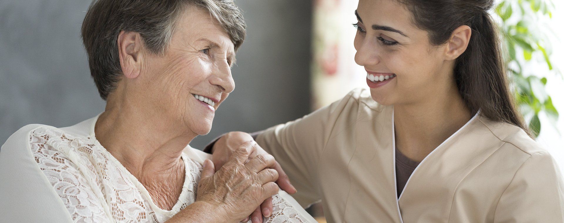Elderly Woman Beside Her Caregiver