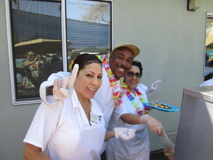 Attentive Staff Prepare Meals for Dementia Care Patients