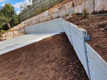 concrete slab with concrete retaining wall