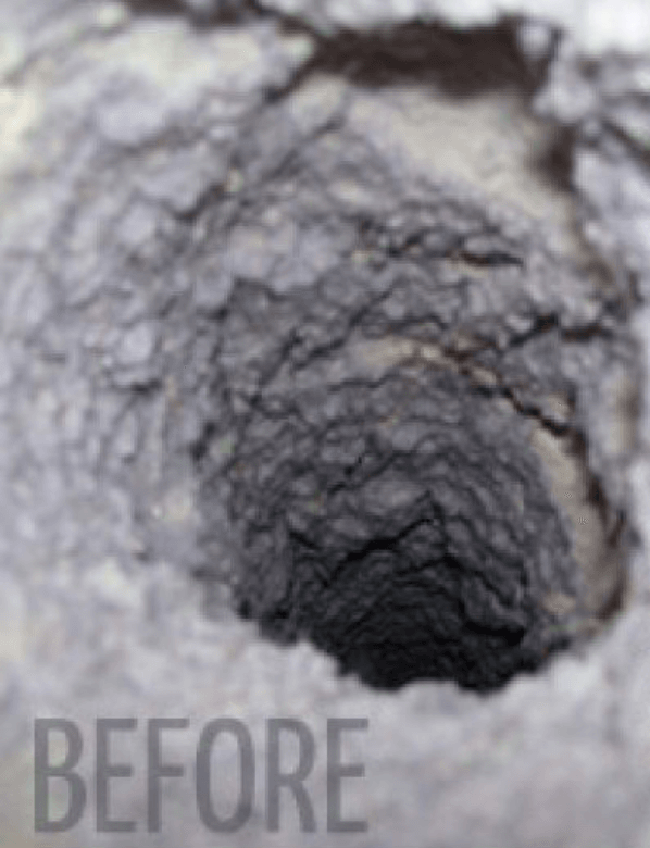 A close up of a hole in a rock with the word before below it