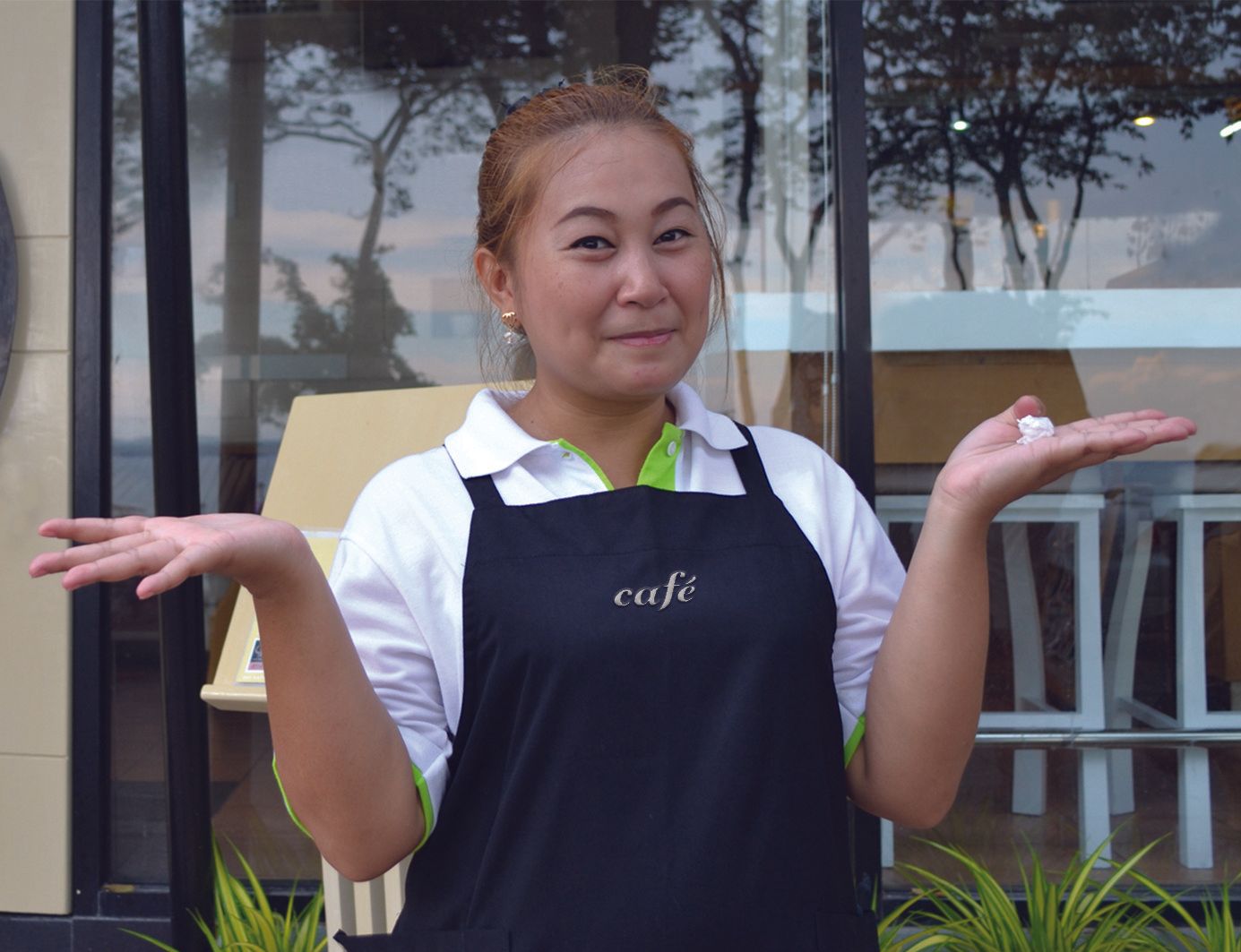 Woman in black apron with 