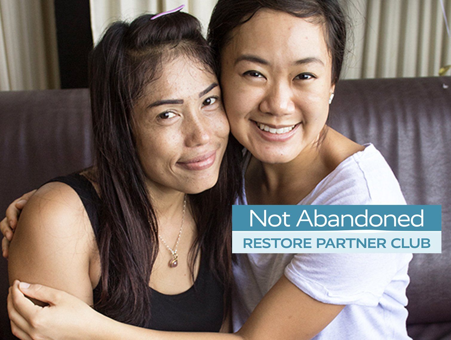 Two smiling people embracing, blue text overlay: 