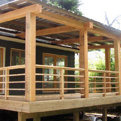 A house with a wooden porch and a metal roof