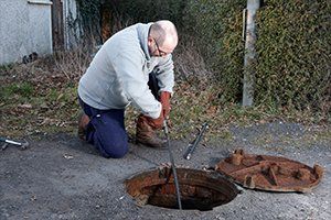 Septic Pumping & Cleaning — Checking Septic Tank in Lexington, SC