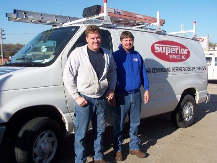 Men with Truck on the Background — Jefferson City, MO — Superior Services Inc. Men with Truck on the Background — Jefferson City, MO — Superior Services Inc.
