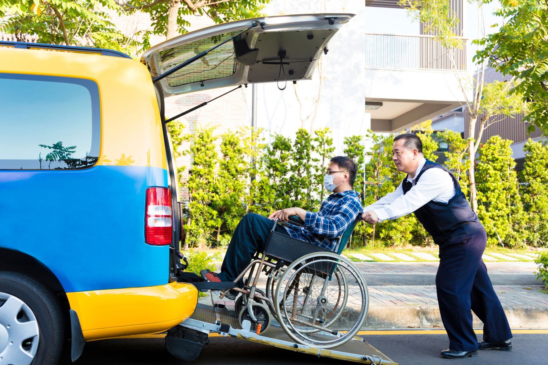 Driver Helping Man on Wheelchair — SC — Guardian Angels