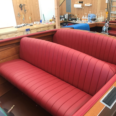 Worker Finalizing Leather Seat — Geneva, WI — Geneva Upholstering Corp Worker Finalizing Leather Seat — Geneva, WI — Geneva Upholstering Corp