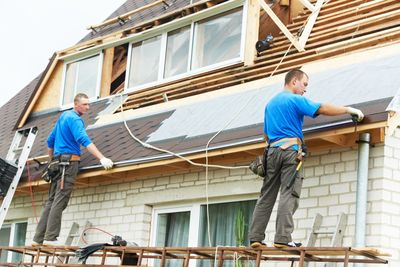 Two Men on Roof - Standing Seam Roofs