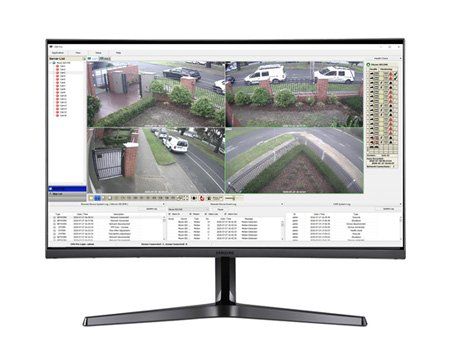 Curved monitor displaying a security camera feed with four views of a building entrance and street.