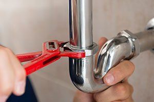 Local Electrician — Plumber Fixing Pipe in Elizabethtown, PA