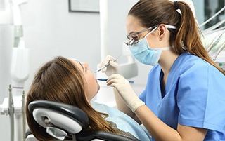 New Patient Information — Patient With Her Dentist in Kalamazoo, MI New Patient Information — Patient With Her Dentist in Kalamazoo, MI