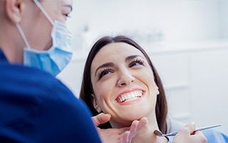 Dentists in Kalamazoo, MI — Dentist Checking Patient's Teeth in Kalamazoo, MI Dentists in Kalamazoo, MI — Dentist Checking Patient's Teeth in Kalamazoo, MI