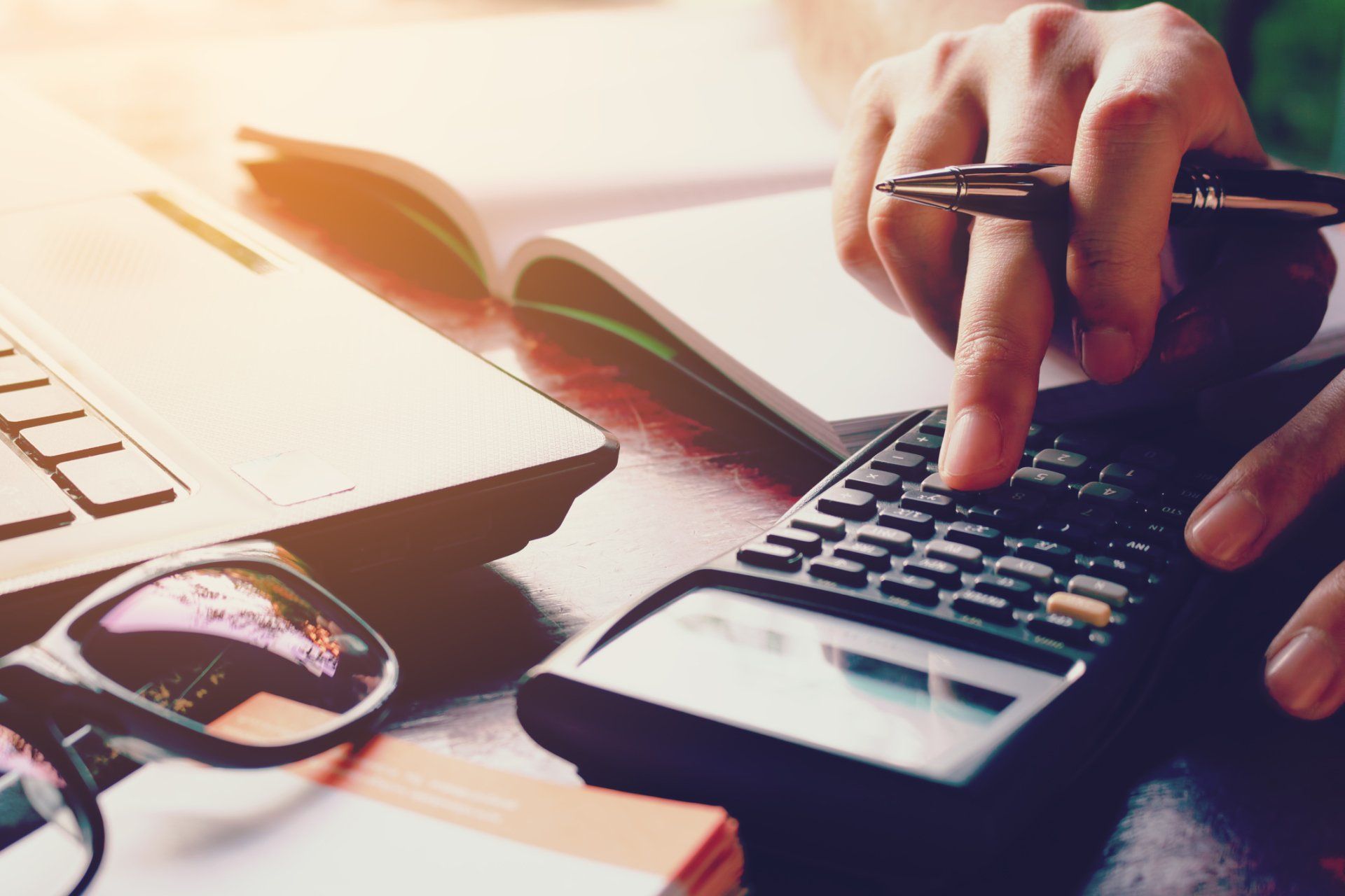 Chapter 7 — Woman Calculating Debt in Aiken, SC Chapter 7 — Woman Calculating Debt in Aiken, SC