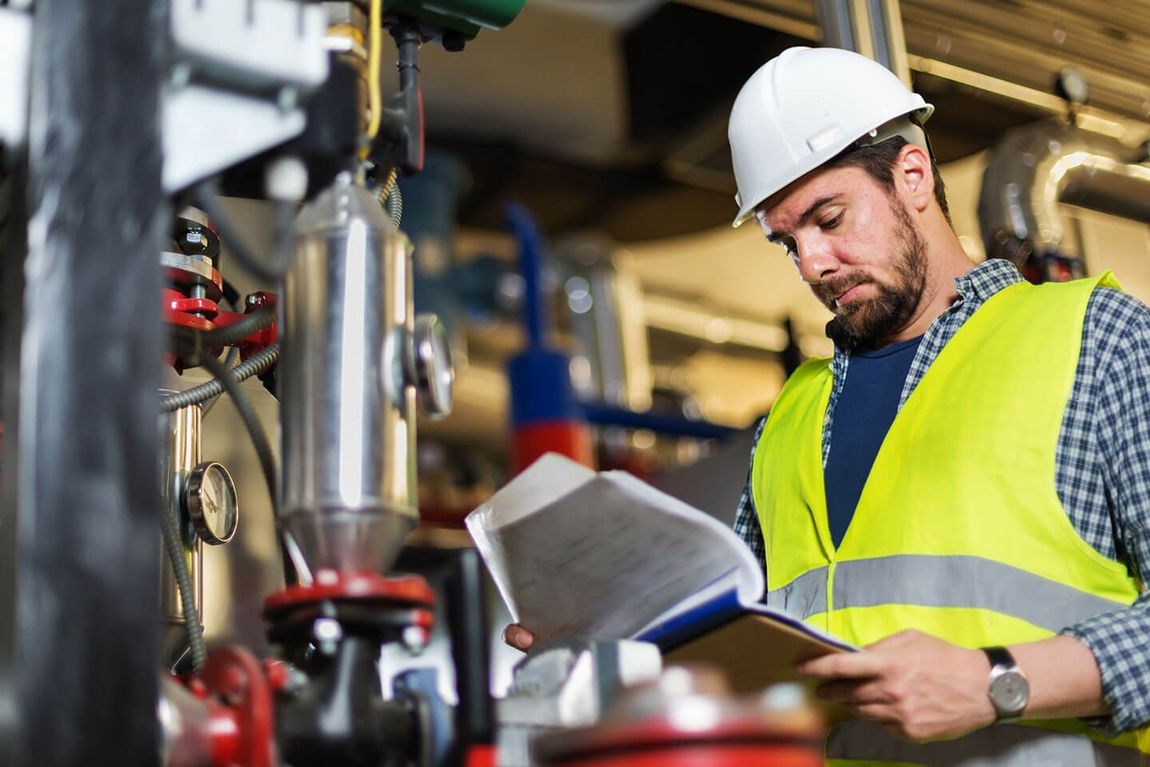 Plumber checking the documents