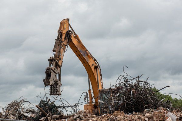 excavator with pinching attachment