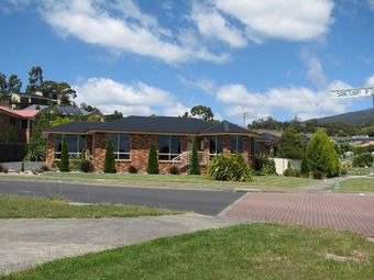 front of red brick home