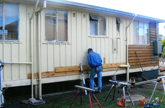 back of a house being fixed