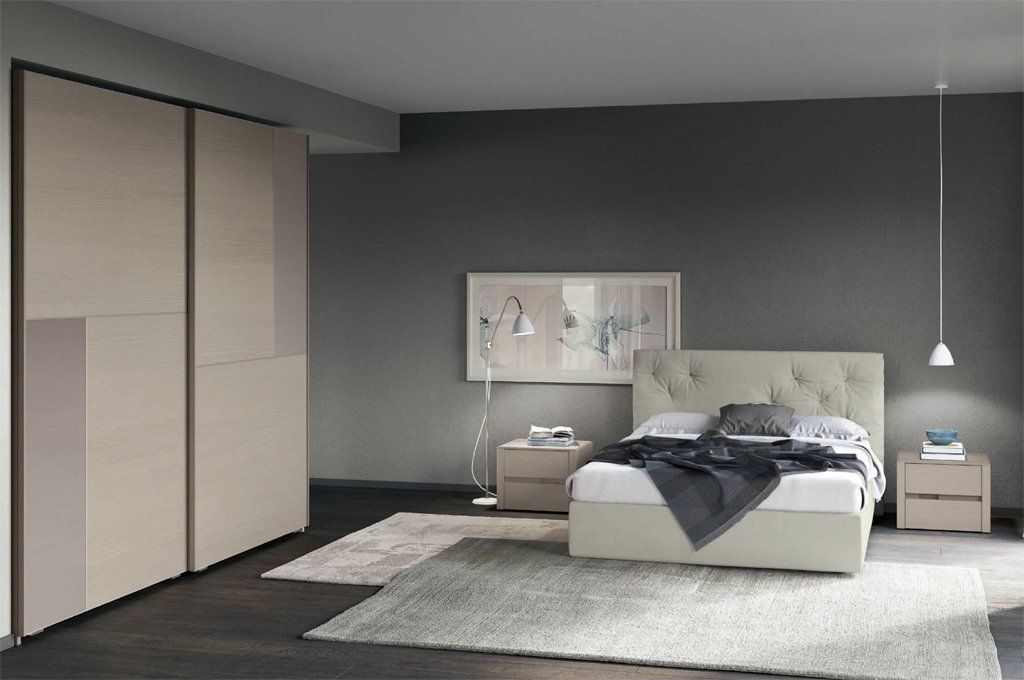 camera moderna con letto in pelle beige