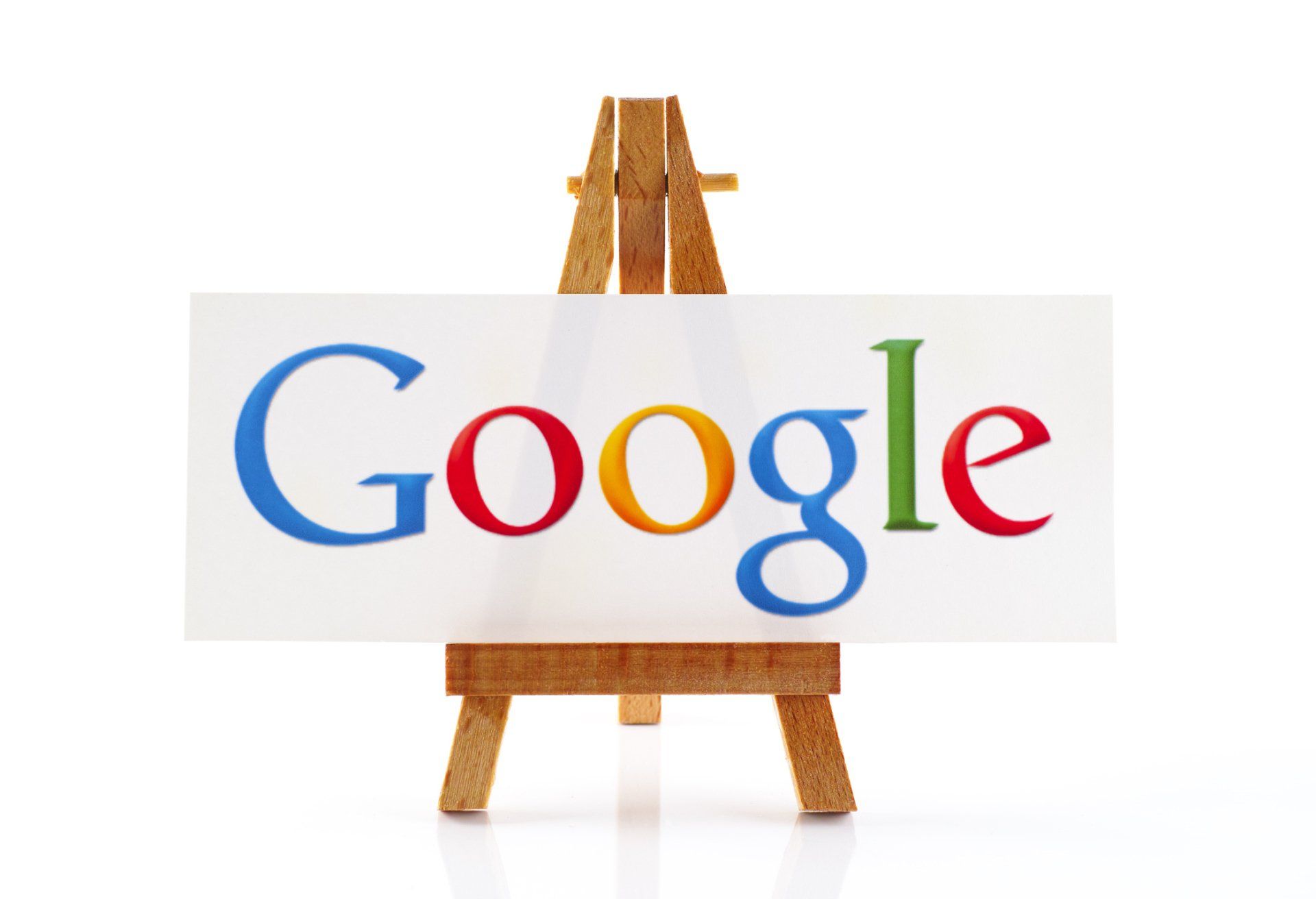 A wooden easel with a google sign on it