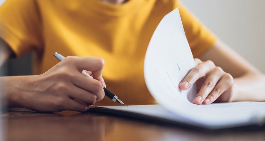 Woman Signing Document — Fort Smith, AR — ASAP Insurance Woman Signing Document — Fort Smith, AR — ASAP Insurance