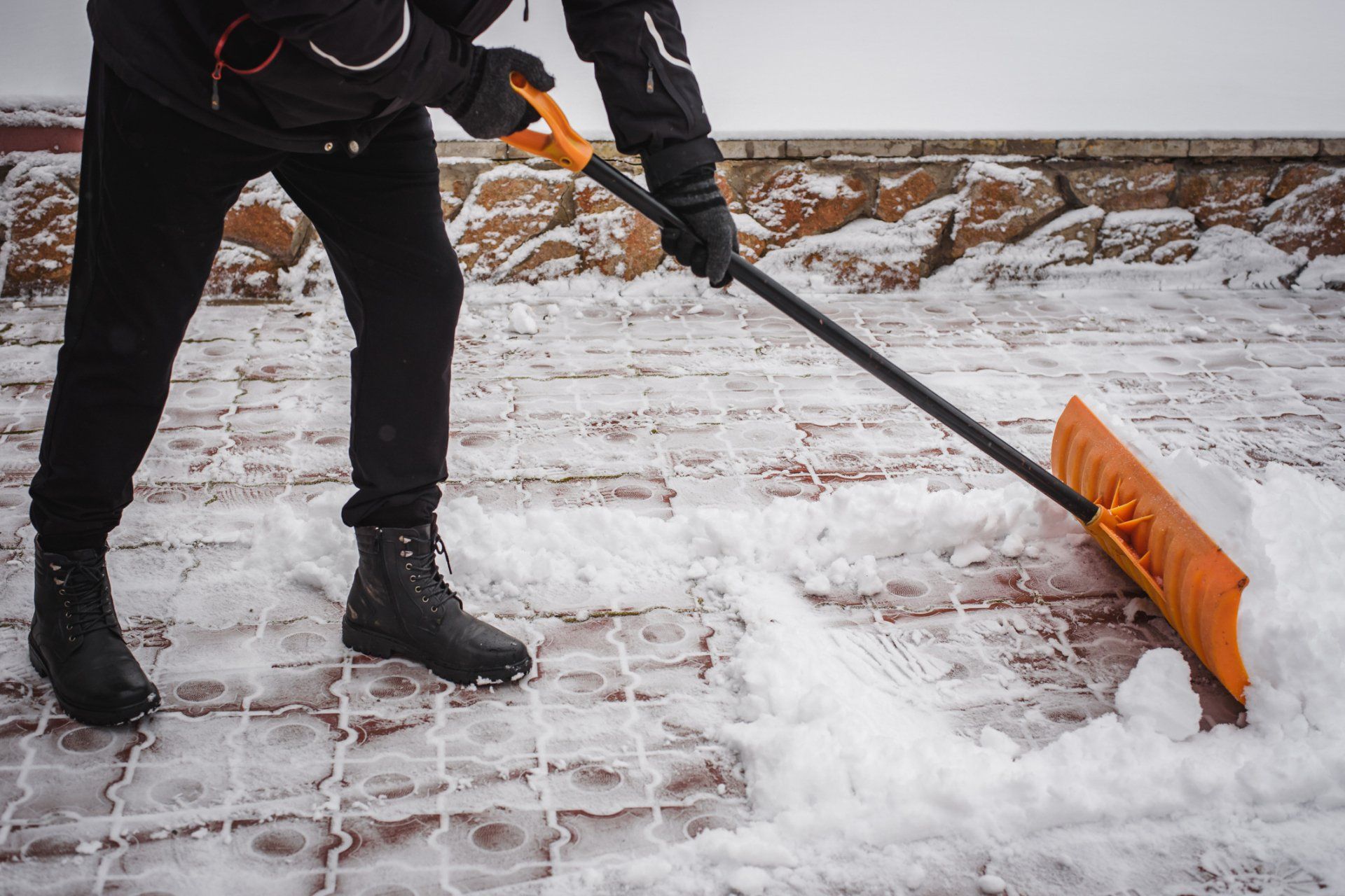 Man Removing Snow — Erie, PA — Brooks Landscape