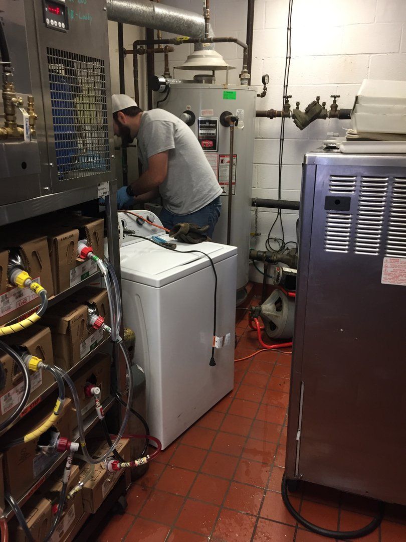 Man Inspecting House Pipeline — Port Huron, MI — Dynamic Drain Services