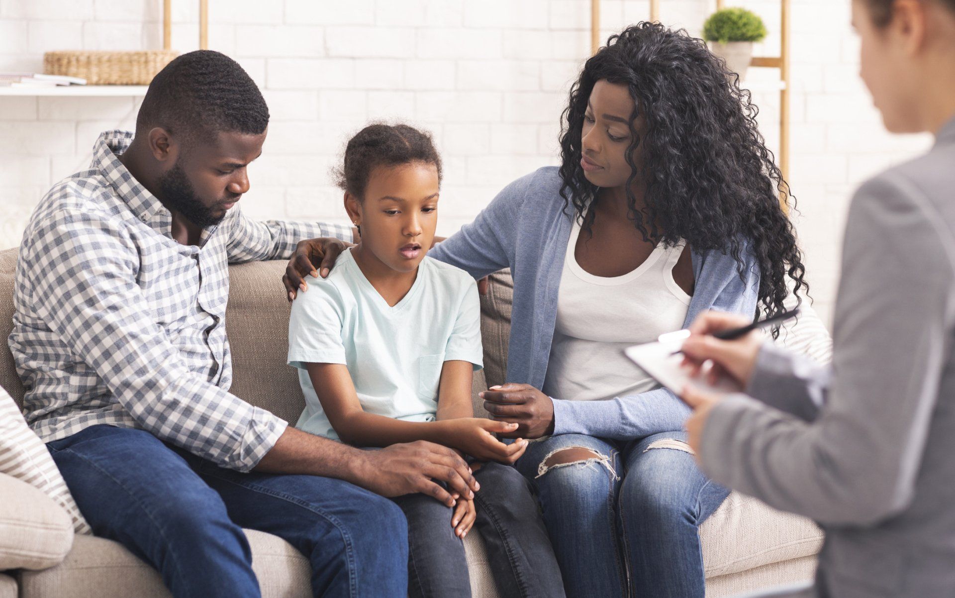 Little girl with her family with counselor