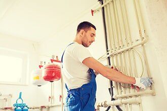 Plumber Repairing a Pipes — Plumbing Contractor in Sacramento, CA Plumber Repairing a Pipes — Plumbing Contractor in Sacramento, CA