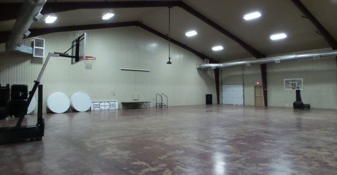 There is a basketball hoop in the middle of the room.