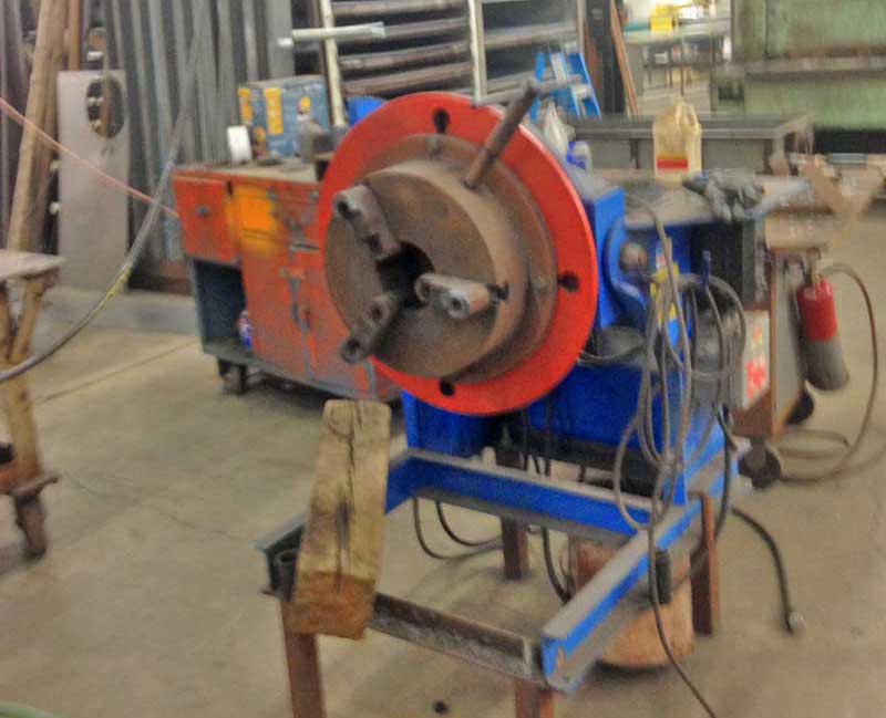 A machine is sitting on a table in a workshop.