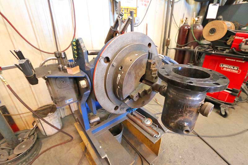 A machine is sitting on a table in a workshop.