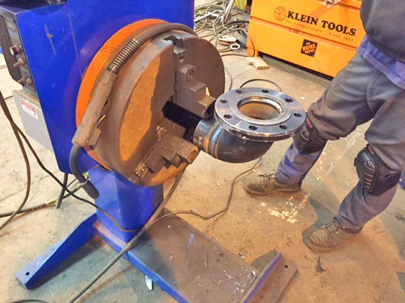 A man is working on a machine that says klein tools