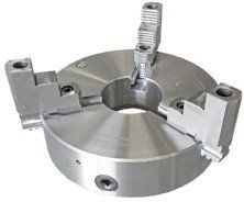 A close up of a lathe chuck on a white background.
