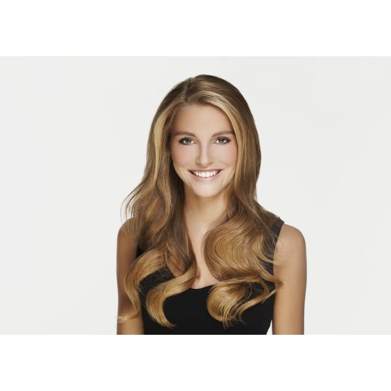 A woman with long hair is smiling and wearing a black tank top