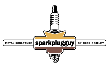 Logo - Sparkplugguy Metal Sculpture by Dick Cooley of West Bend, WI 