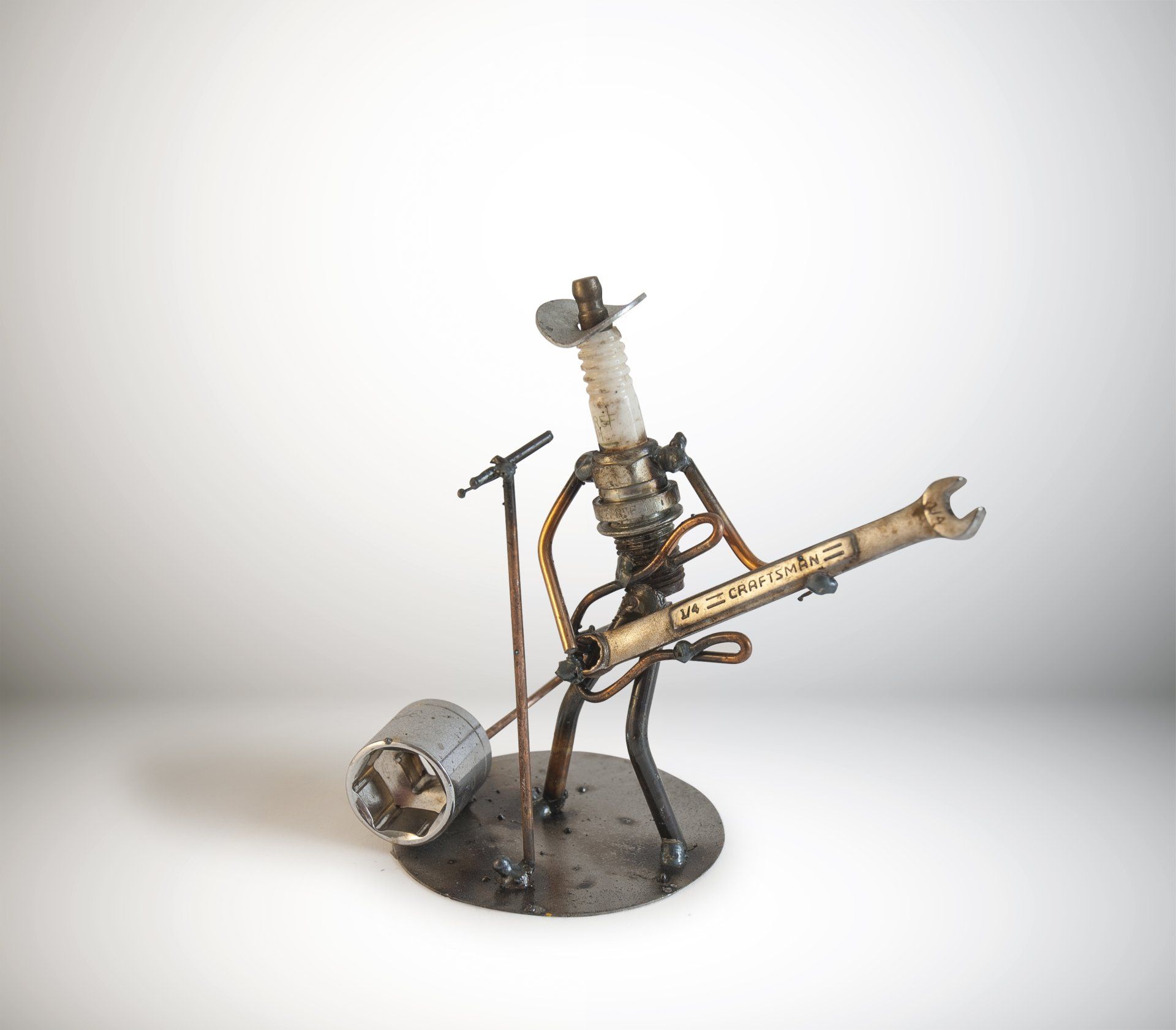 Sparkplug Sculpture of Cowboy Singer playing Guitar