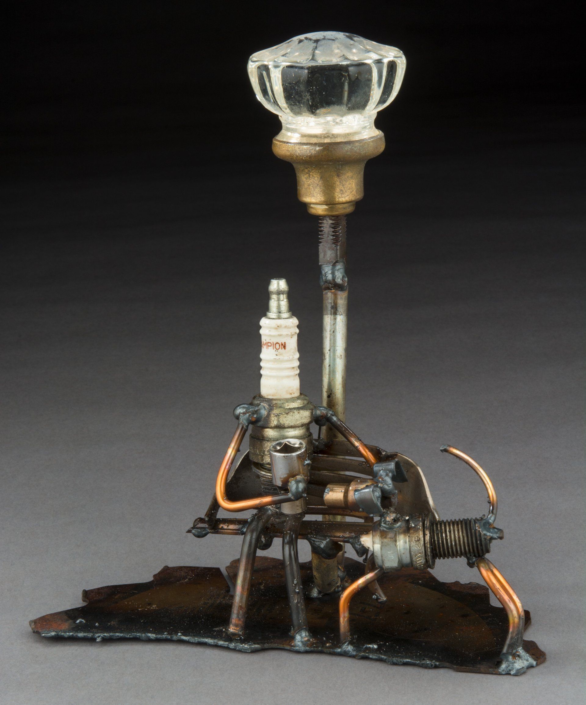 Sparkplug Sculpture of Man and Dog Figurines under Streetlight
