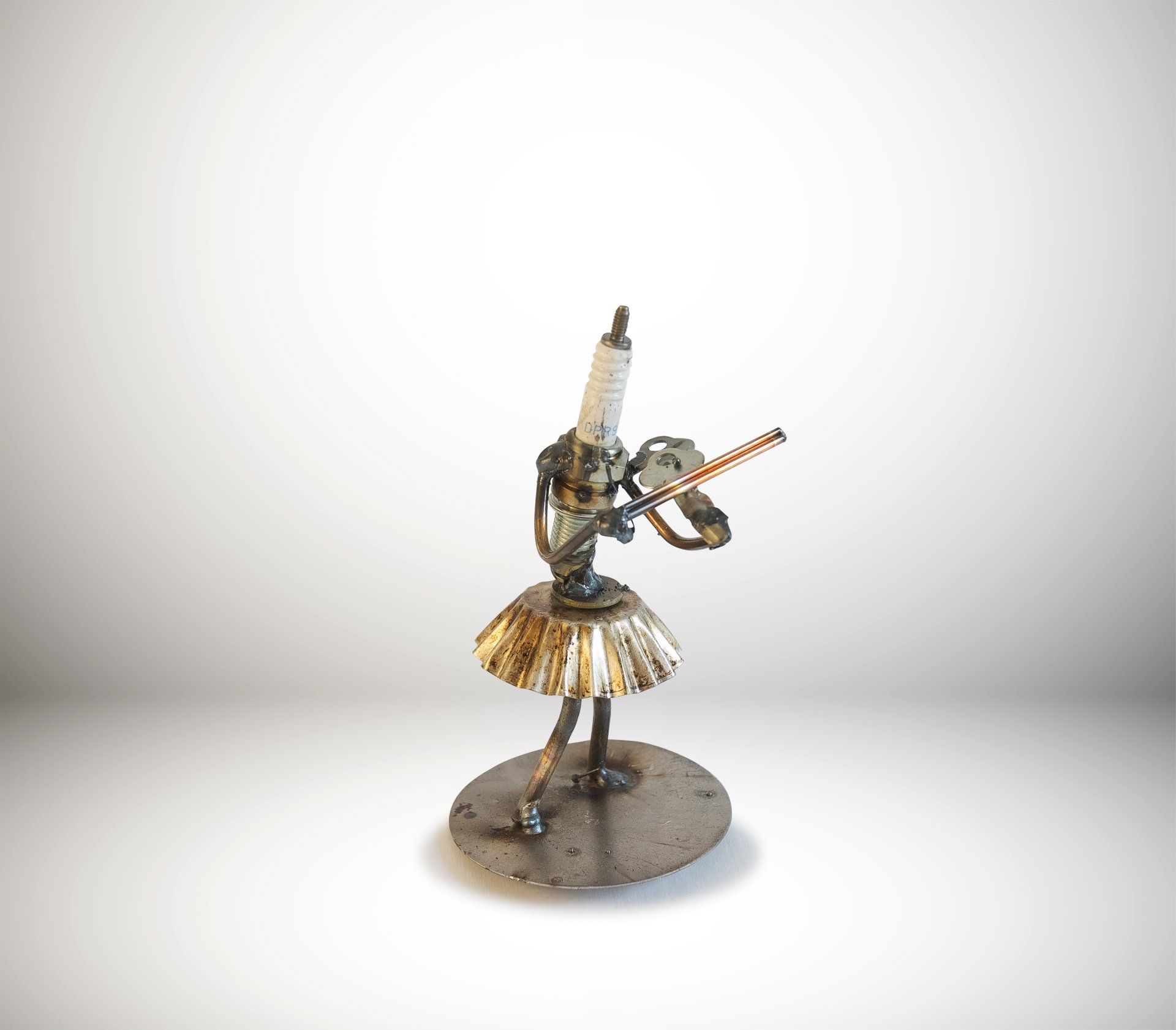 Sparkplug Sculpture of Violinist