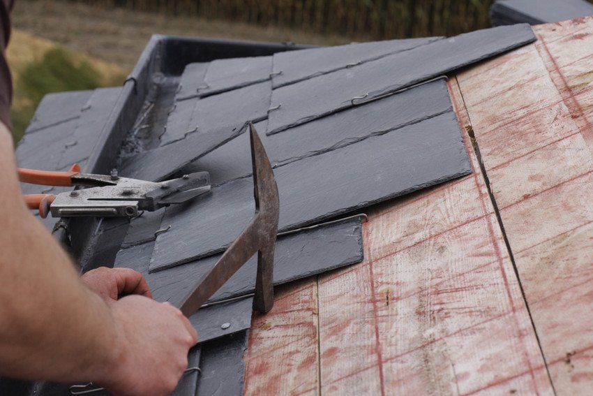 Roofer made a roof with slates