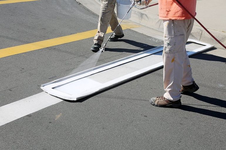 someone spraying paint for markings
