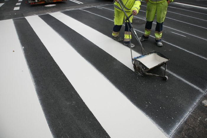 workers are doing road sign