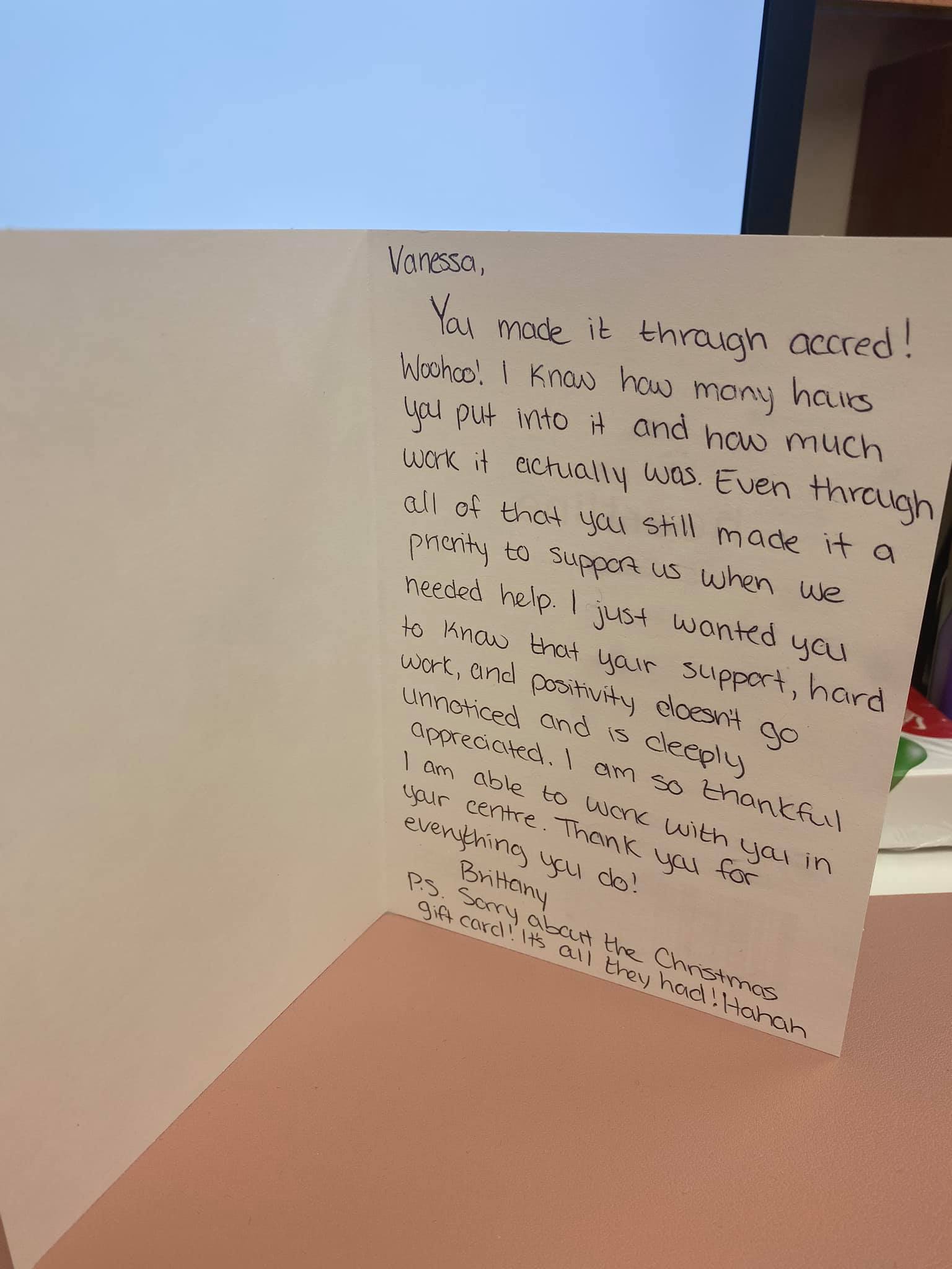 A piece of paper with writing on it is sitting on a table