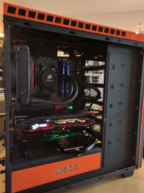 A black and orange computer case with the word next on it