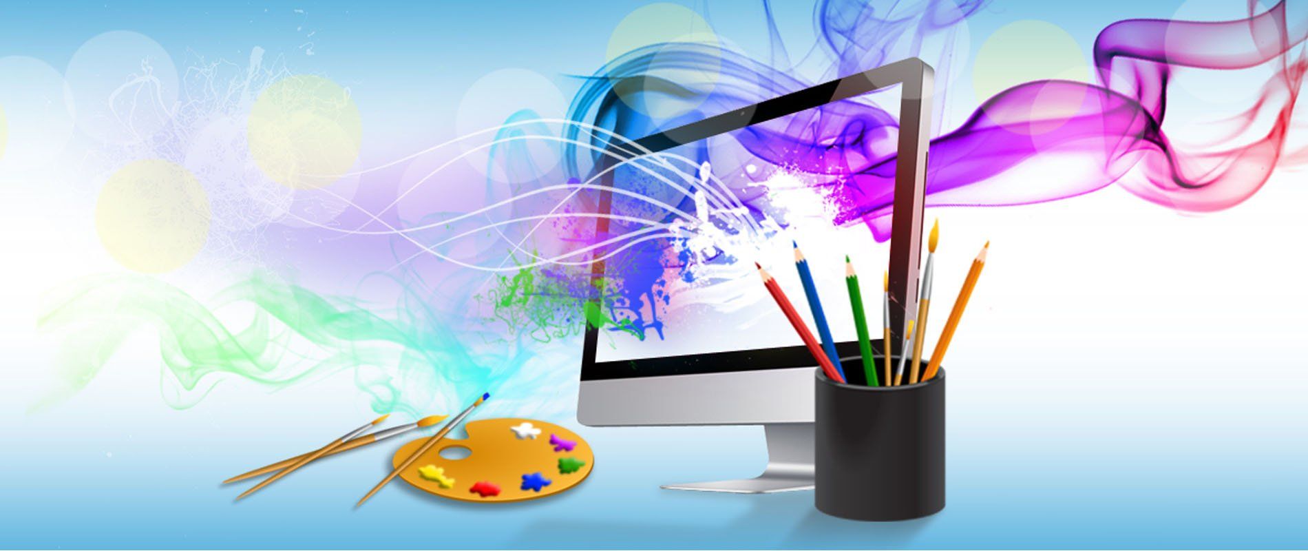 A computer with a palette and pencils next to it