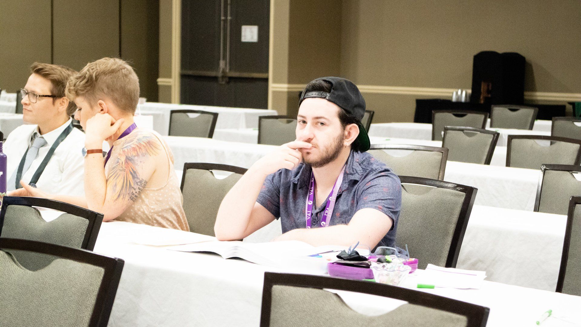 A person sits focused on a presentation