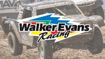 Walker Evans Racing logo on a dirty off-road racing truck, with mud.