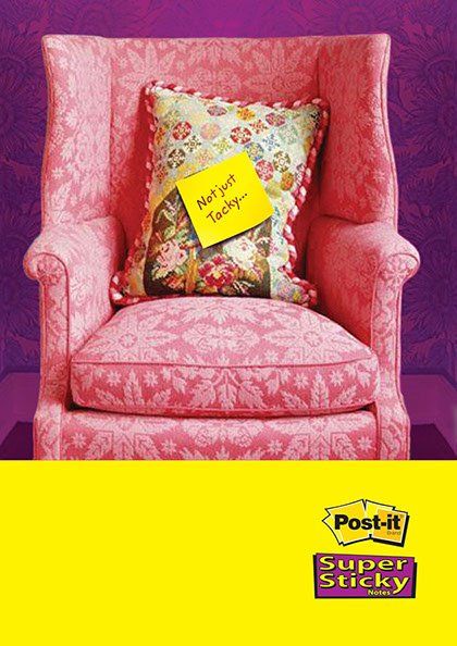 A pink chair with a note on it that says