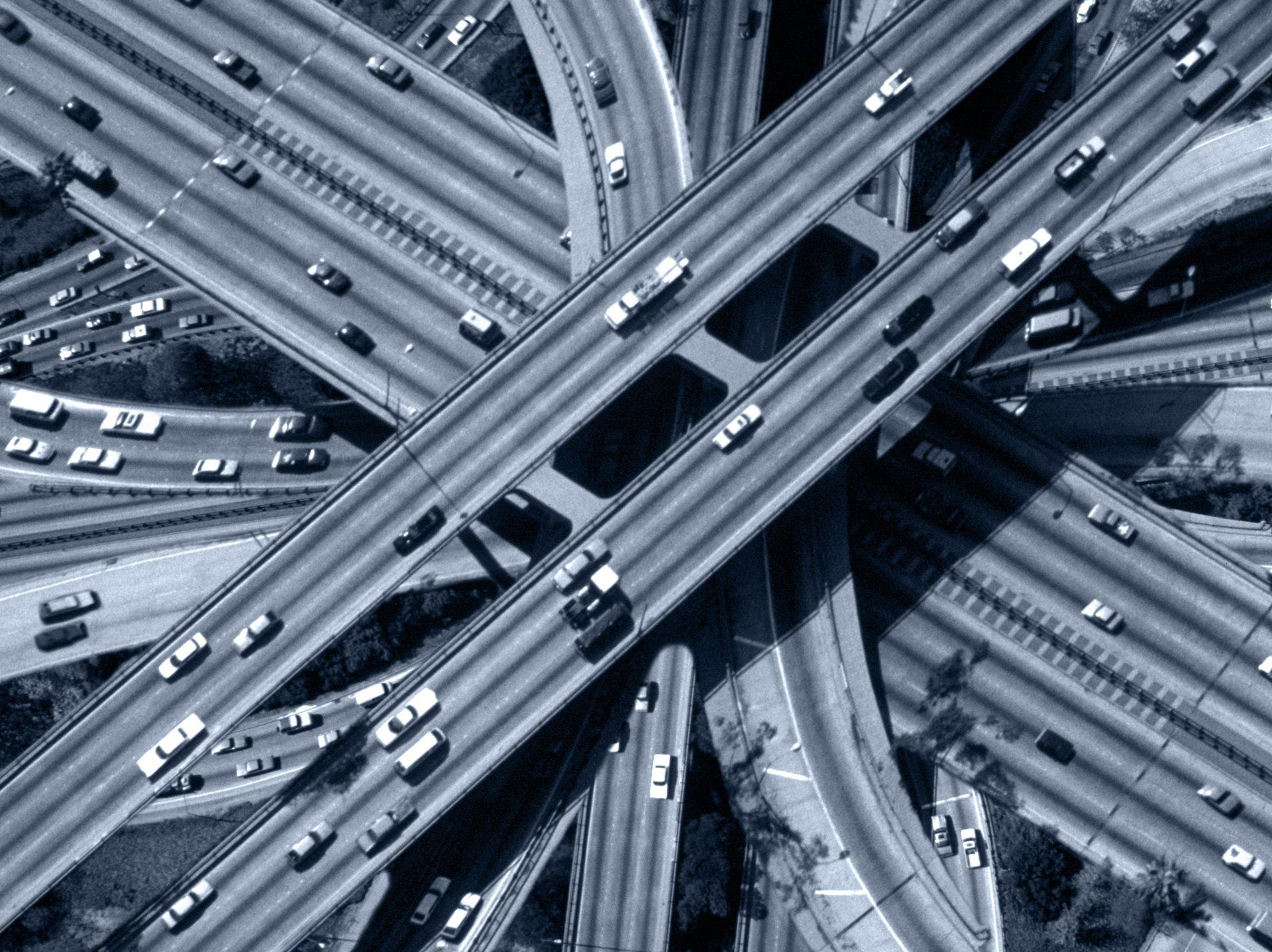 An aerial view of a highway intersection with lots of traffic
